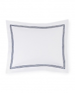 Grande Hotel White/Navy Standard Pillow Sham These linens are styled after those that grace the beds of some of the finest hotels in the world. So if you\'re wondering why you always sleep so well in a five-star hotel, this may be the answer. This ever-popular percale is embroidered with tailored double-rows of satin stitch in colors numerous enough to thrill a decorator. Plus, they\'re woven by our masters in Italy to last through many washings.

Fabrication:
Percale with double-row of satin stitch embroidery
Duvet Cover: U-Shape on top of bed
Shams: 4-sides
Flat Sheet and Pillowcases: Along cuff

Finishing:
Knife-edge hem on Duvet Covers
Classic-style flanges, approximate measurements:
Shams: 3-inches; Boudoir: 2-inches
Flat Sheet and Pillowcase cuffs: 4-inches

Hem:
Plain